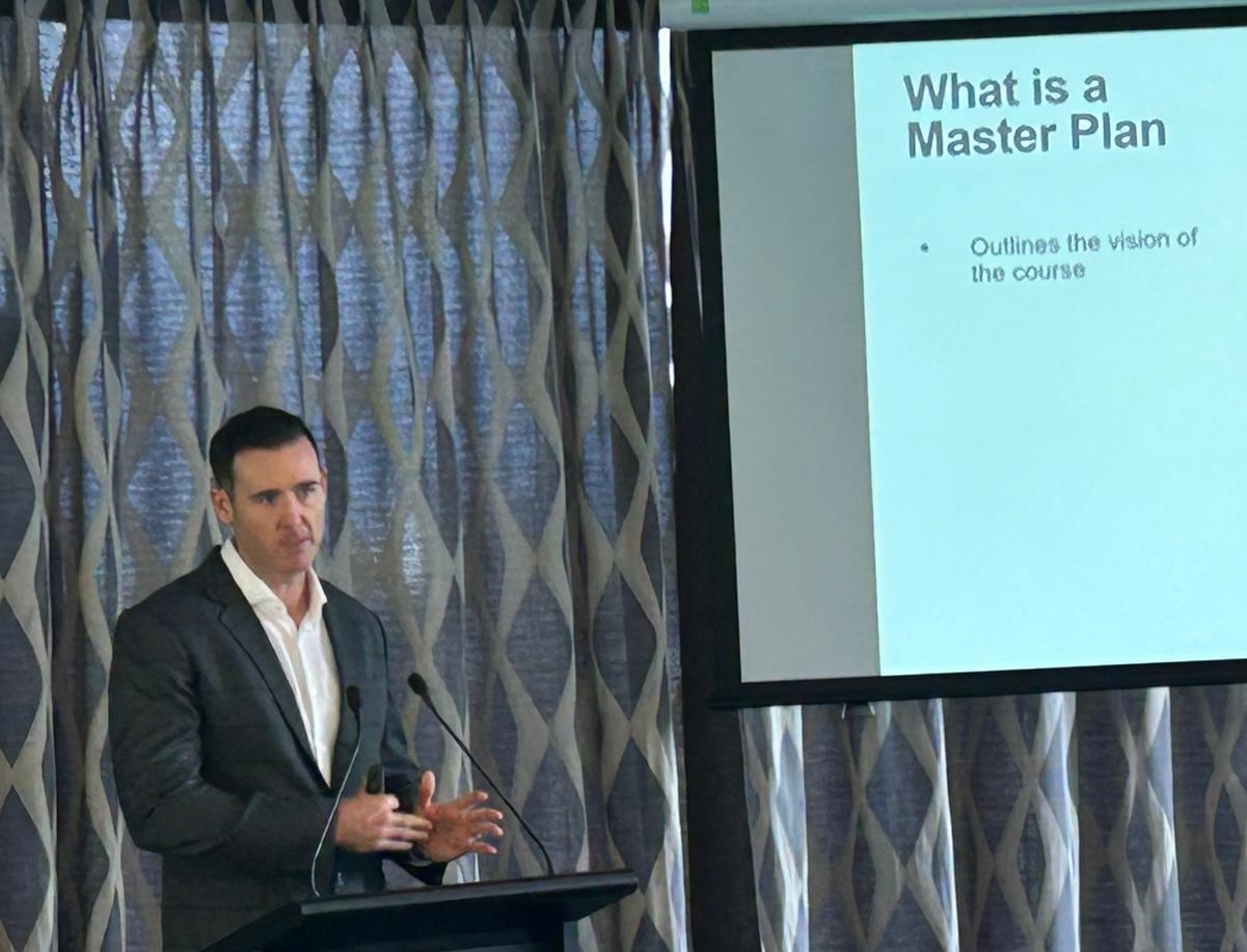 Brad Revill presenting at the 2025 New Zealand Golf Industry Conference in Auckland on the benefits of a golf course master plan.